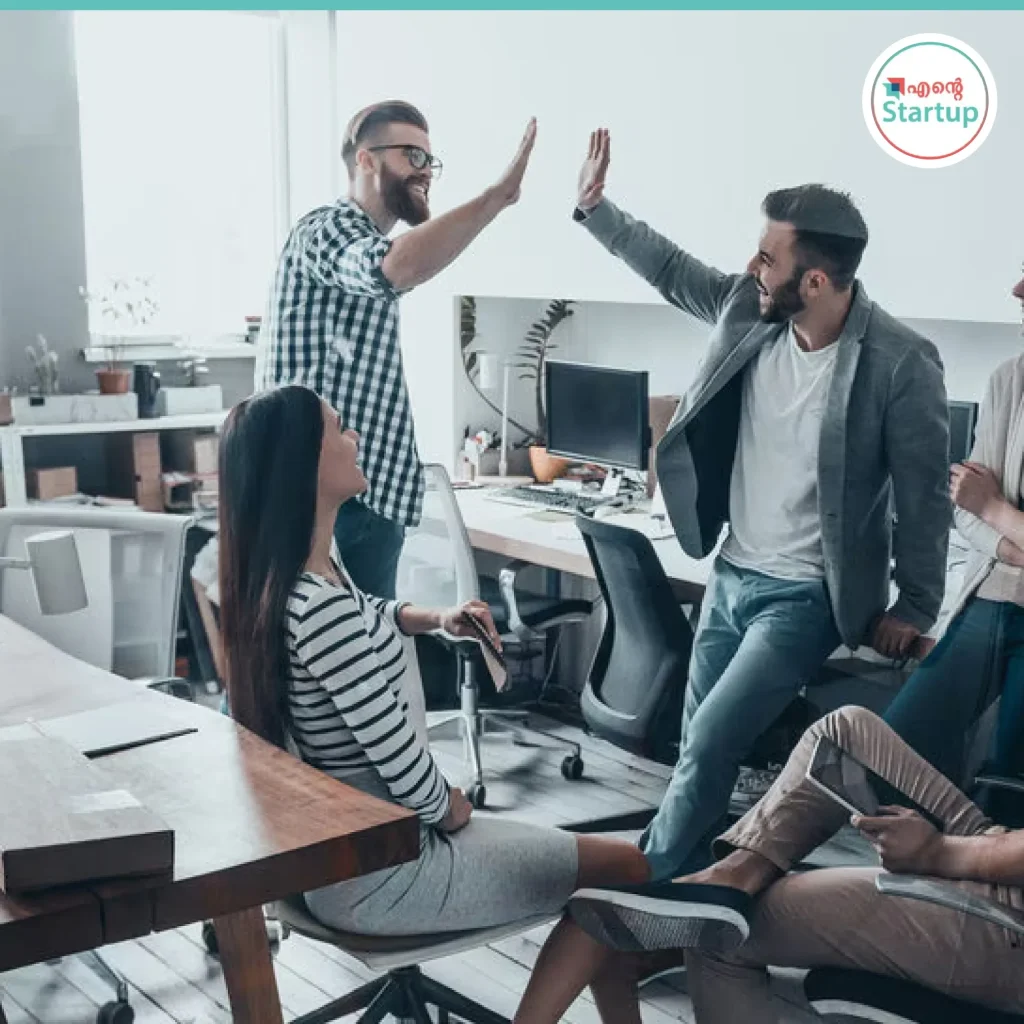 A group of professionals working in a modern office, representing the rise of India tech startups in 2025.